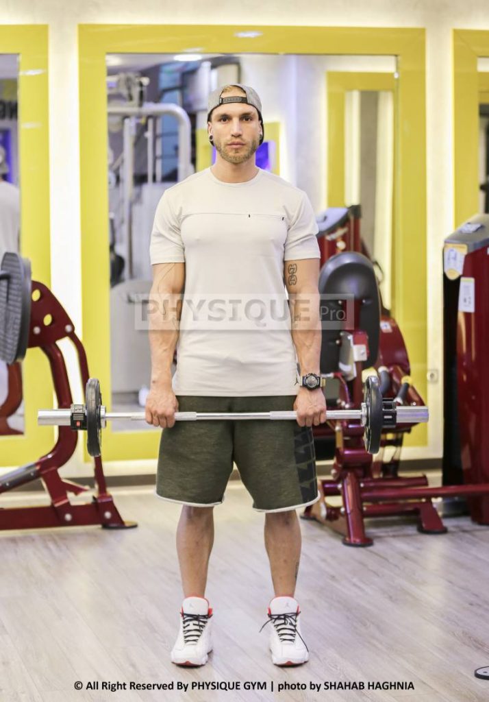 آموزش حرکت جلو بازو هالتر ایستاده مچ برعکس