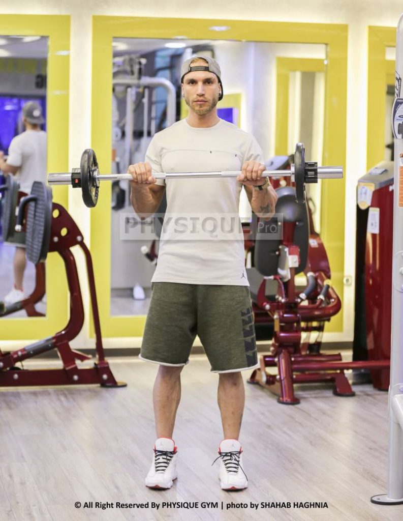 آموزش حرکت جلو بازو هالتر ایستاده مچ برعکس