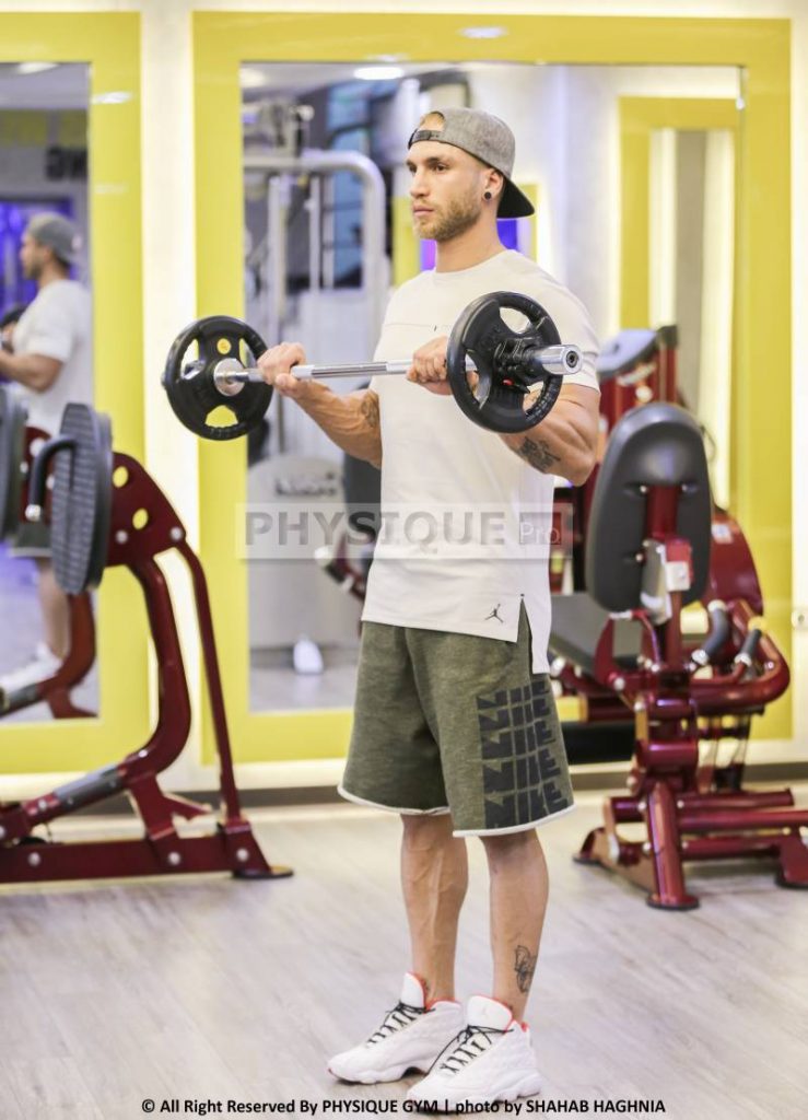 آموزش حرکت جلو بازو هالتر ایستاده مچ برعکس